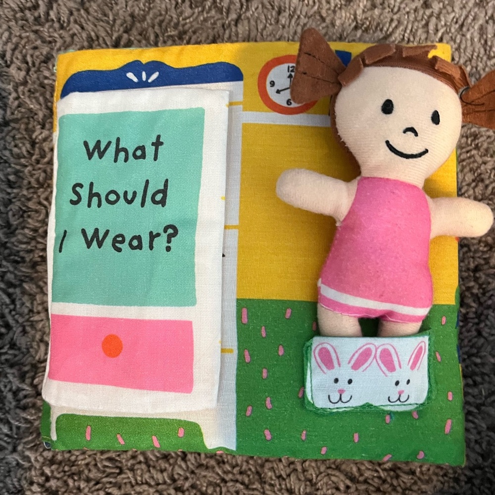 Melissa and Doug plush doll dress up book